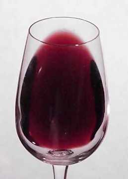 The color of a red wine in a tilted glass