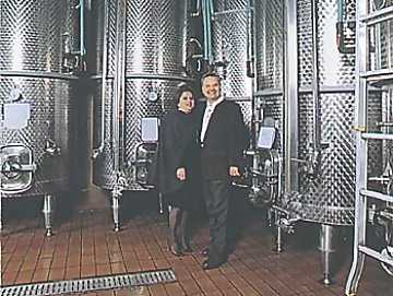 Mr. and Mrs. Santarelli in their cellar